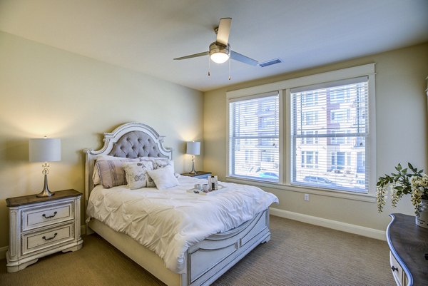 Cozy bedroom with elegant furnishing at Everleigh Central Park Apartments, exemplifying Greystar luxury apartments