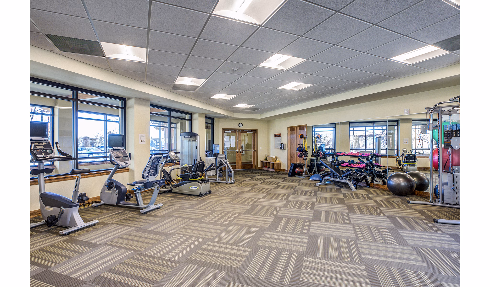 Modern fitness center with state-of-the-art equipment at Everleigh Central Park Apartments
