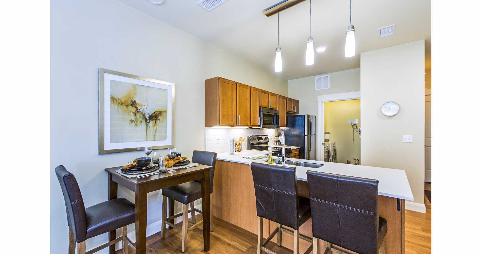 Modern kitchen featuring sleek countertops and stainless steel appliances at Everleigh Central Park Apartments