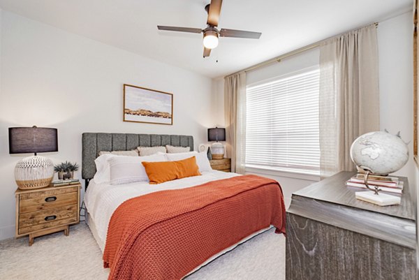 Cozy bedroom with modern design at Elan Keller Ranch Apartments, featuring ample natural light and elegant furnishings