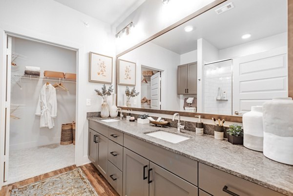 Modern bathroom featuring sleek fixtures and granite countertops in Elan Keller Ranch Apartments