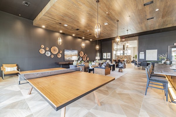 Luxurious game room with pool table and seating at Elan Keller Ranch Apartments