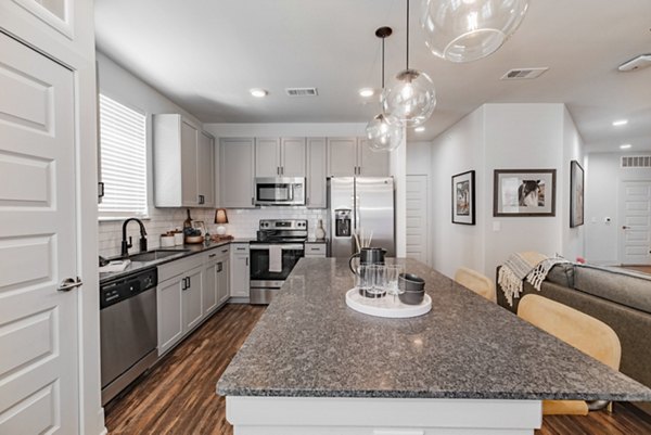 Modern kitchen with stainless steel appliances in Elan Keller Ranch Apartments
