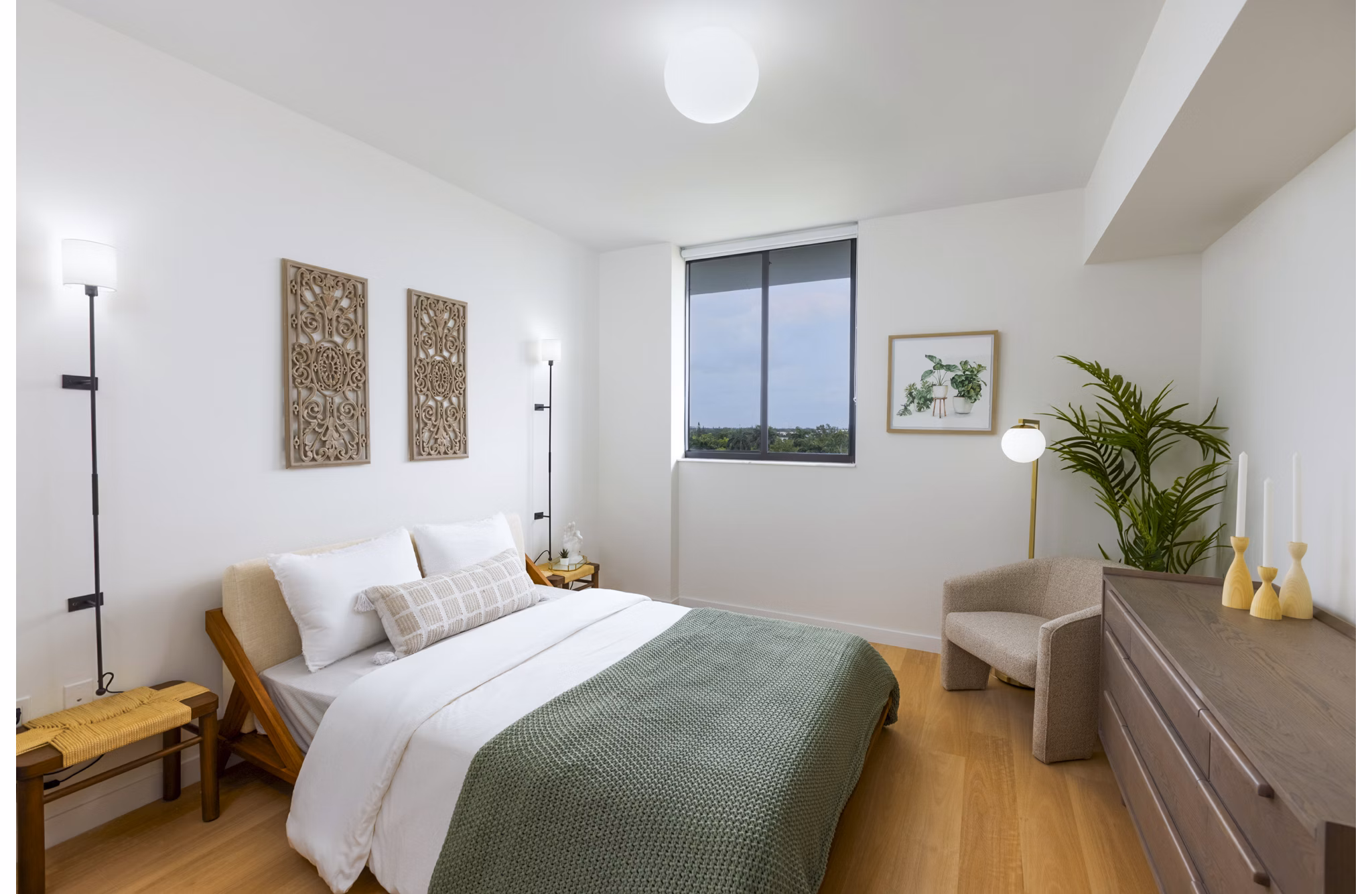 Modern bedroom with large windows in Biscayne 112 Apartments featuring luxurious design elements for a relaxing living experience