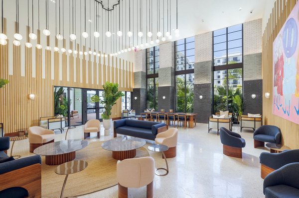 Modern clubhouse with elegant decor at Biscayne 112 Apartments in Miami, featuring stylish seating areas and community gathering spaces