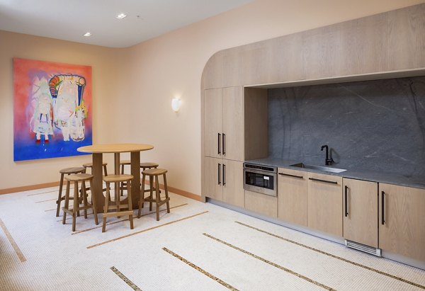 Clubhouse at Biscayne 112 Apartments: Modern lounge area with premium seating and stylish decor in vibrant community setting
