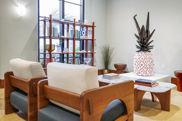 Clubhouse with modern design and cozy seating at Biscayne 112 Apartments