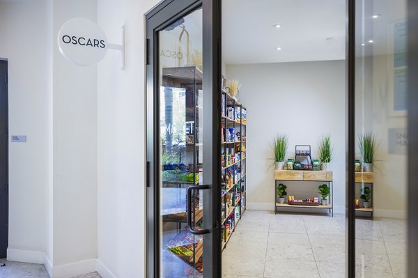 Modern clubhouse with a cozy seating area and billiards at Biscayne 112 Apartments