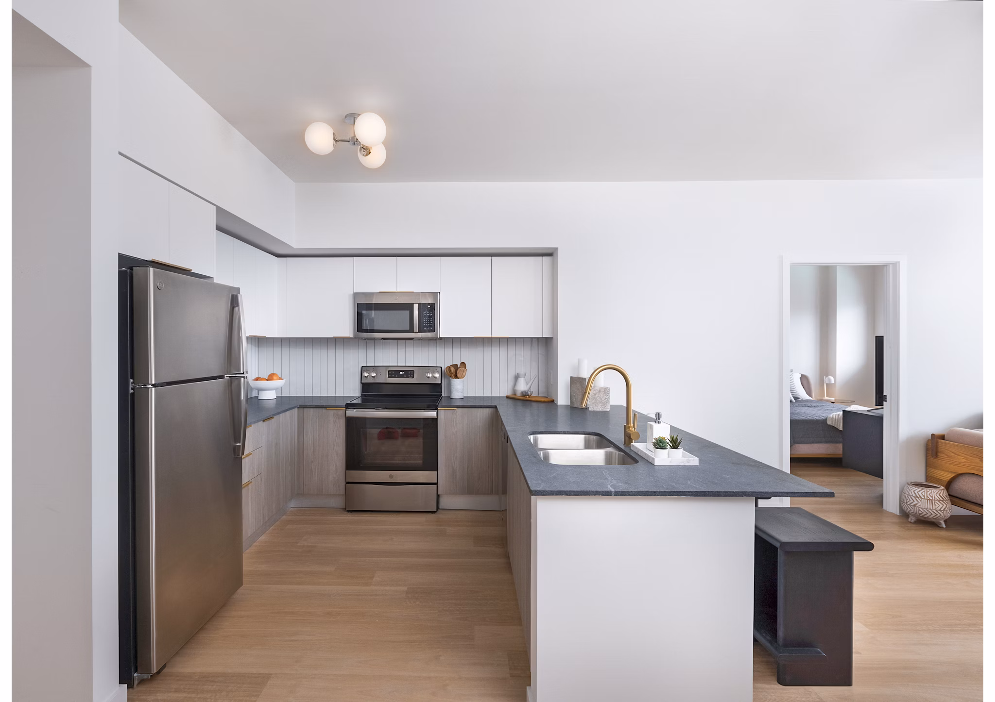 Modern kitchen with stainless steel appliances at Biscayne 112 Apartments