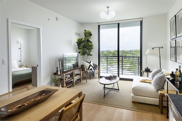 Spacious, modern living room with stylish furnishings in Biscayne 112 Apartments