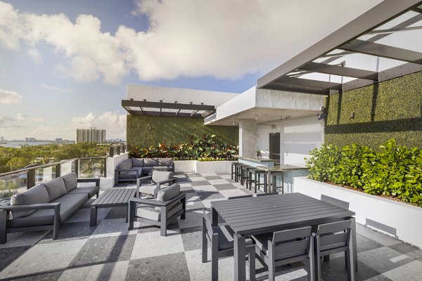 Spacious patio with cozy seating at Biscayne 112 Apartments