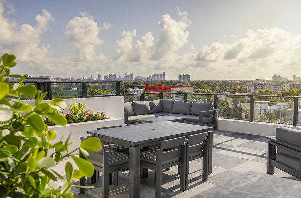 Patio with modern outdoor furniture at Biscayne 112 Apartments, a Greystar luxury community in North Miami Beach
