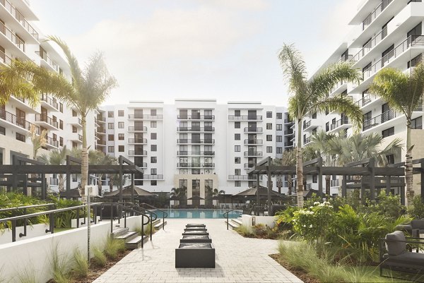 Stylish patio with modern furnishings at Biscayne 112 Apartments, perfect for outdoor relaxation and social gatherings