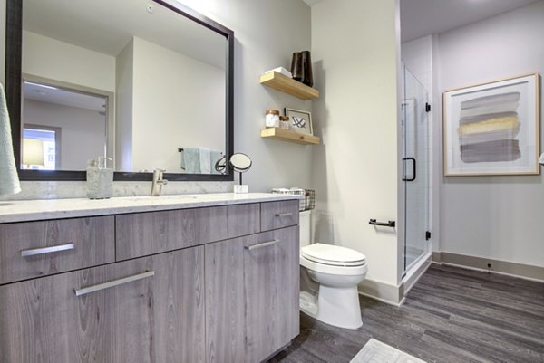 Luxurious bathroom featuring modern fixtures at The Dillon Apartments