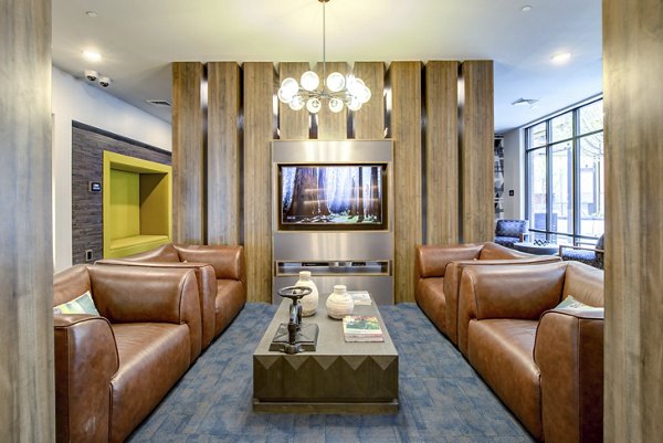 Clubhouse featuring modern design and luxurious seating at The Dillon Apartments in a Greystar community