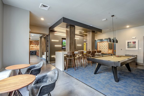 Game room with billiards and seating at The Dillon Apartments, a luxury community offering premier amenities