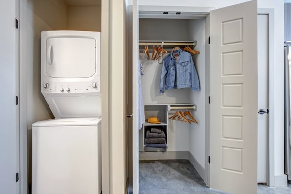 Laundry room with modern appliances at The Dillon Apartments, luxury living spaces by Greystar