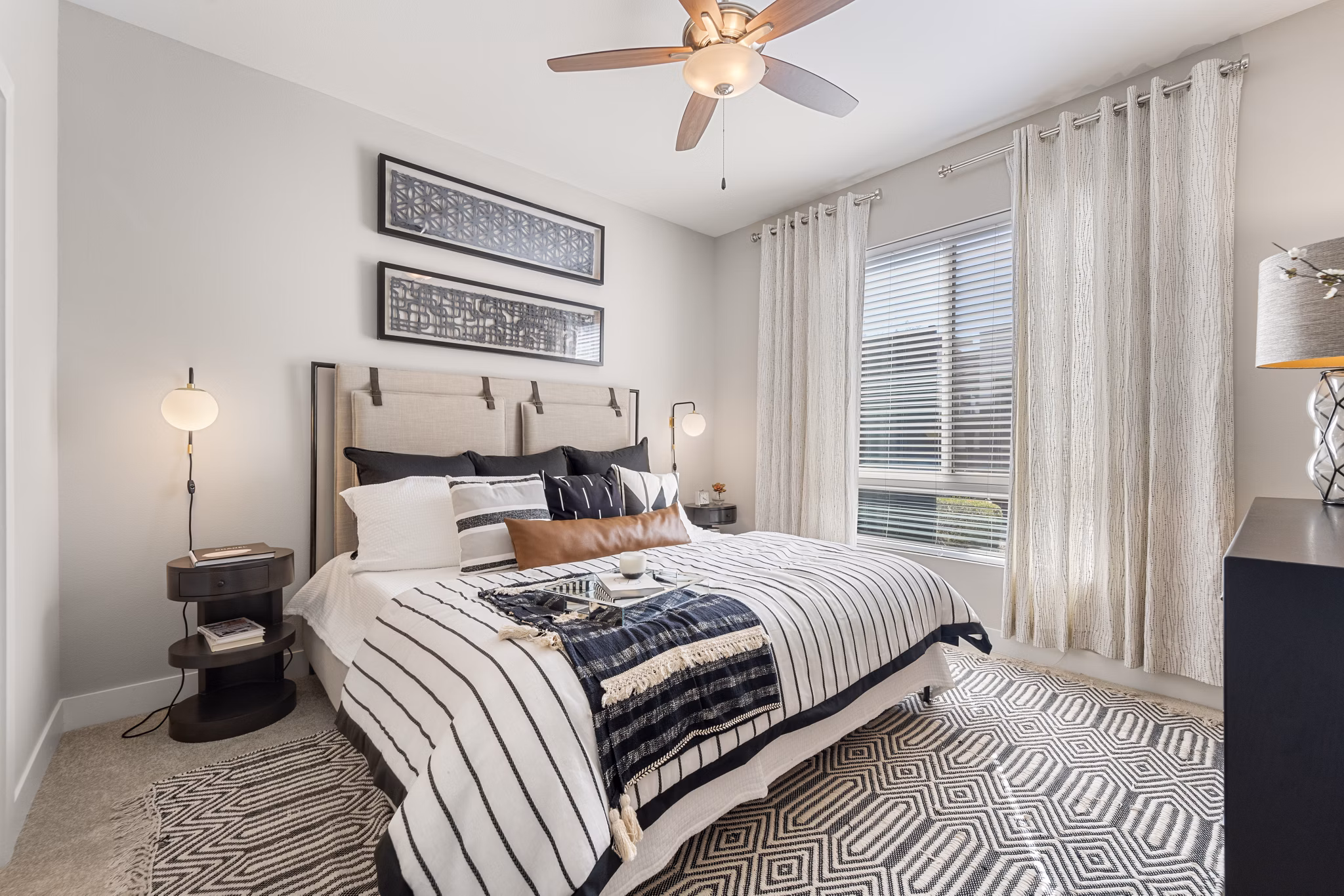 Spacious bedroom with modern furnishings at Maxwell on 66th Apartments in luxury community
