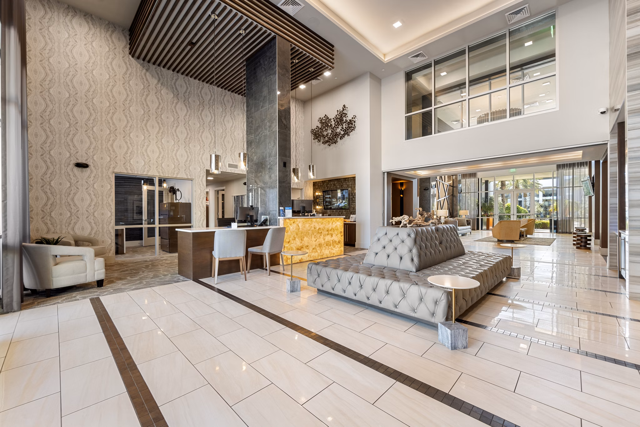 Inviting clubhouse with modern design at Maxwell on 66th Apartments, offering luxury social spaces and community amenities