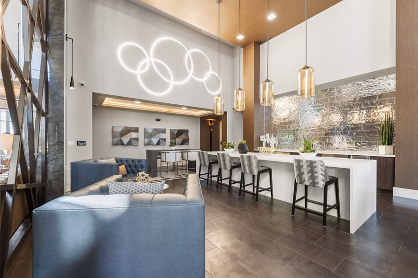 Contemporary clubhouse with stylish seating and communal spaces at Maxwell on 66th Apartments