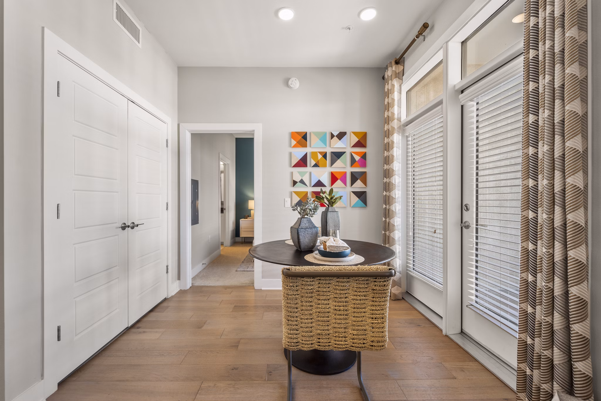 Dining room with elegant lighting and modern furnishings at Maxwell on 66th Apartments
