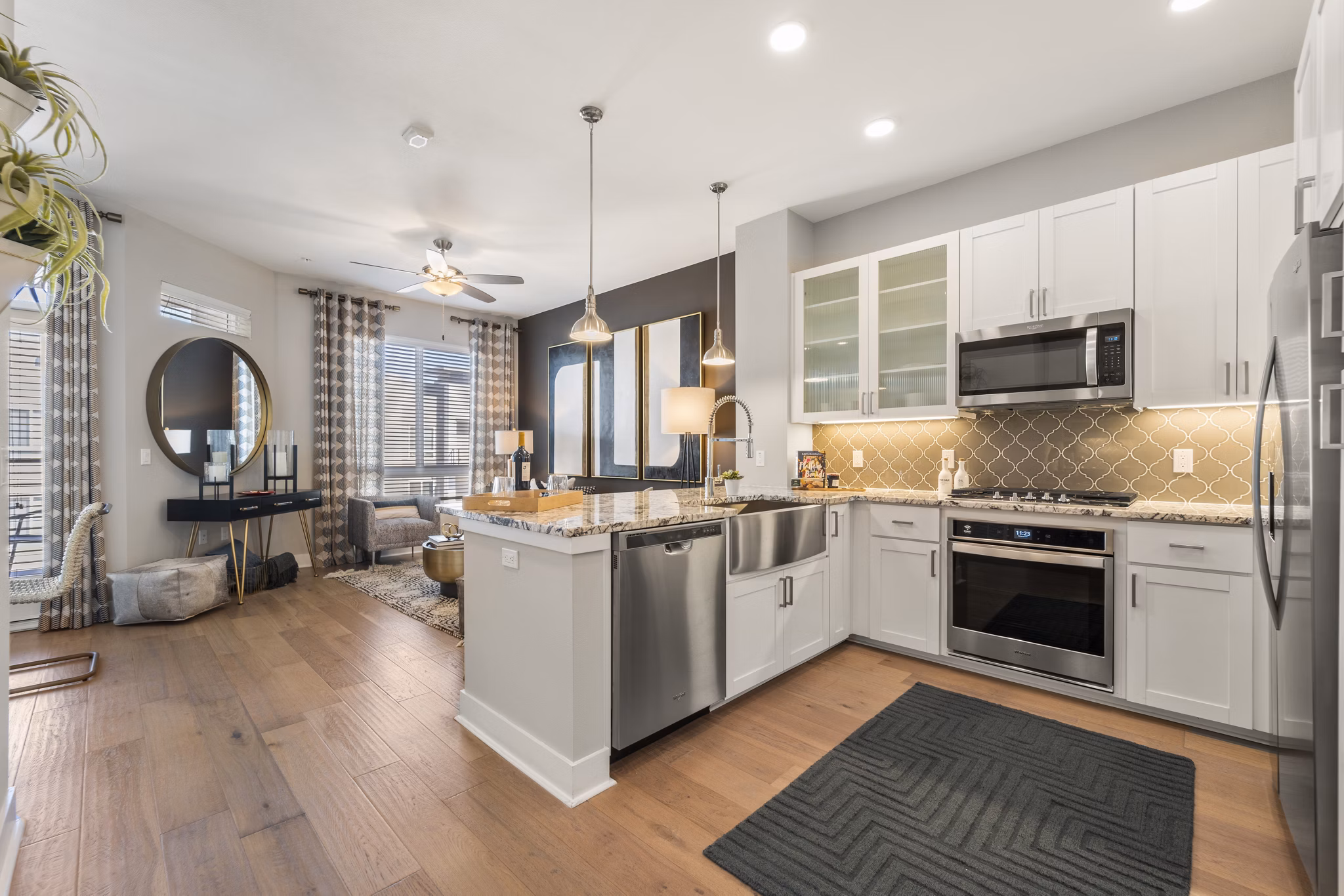 Modern kitchen featuring sleek countertops and stainless steel appliances at Maxwell on 66th Apartments