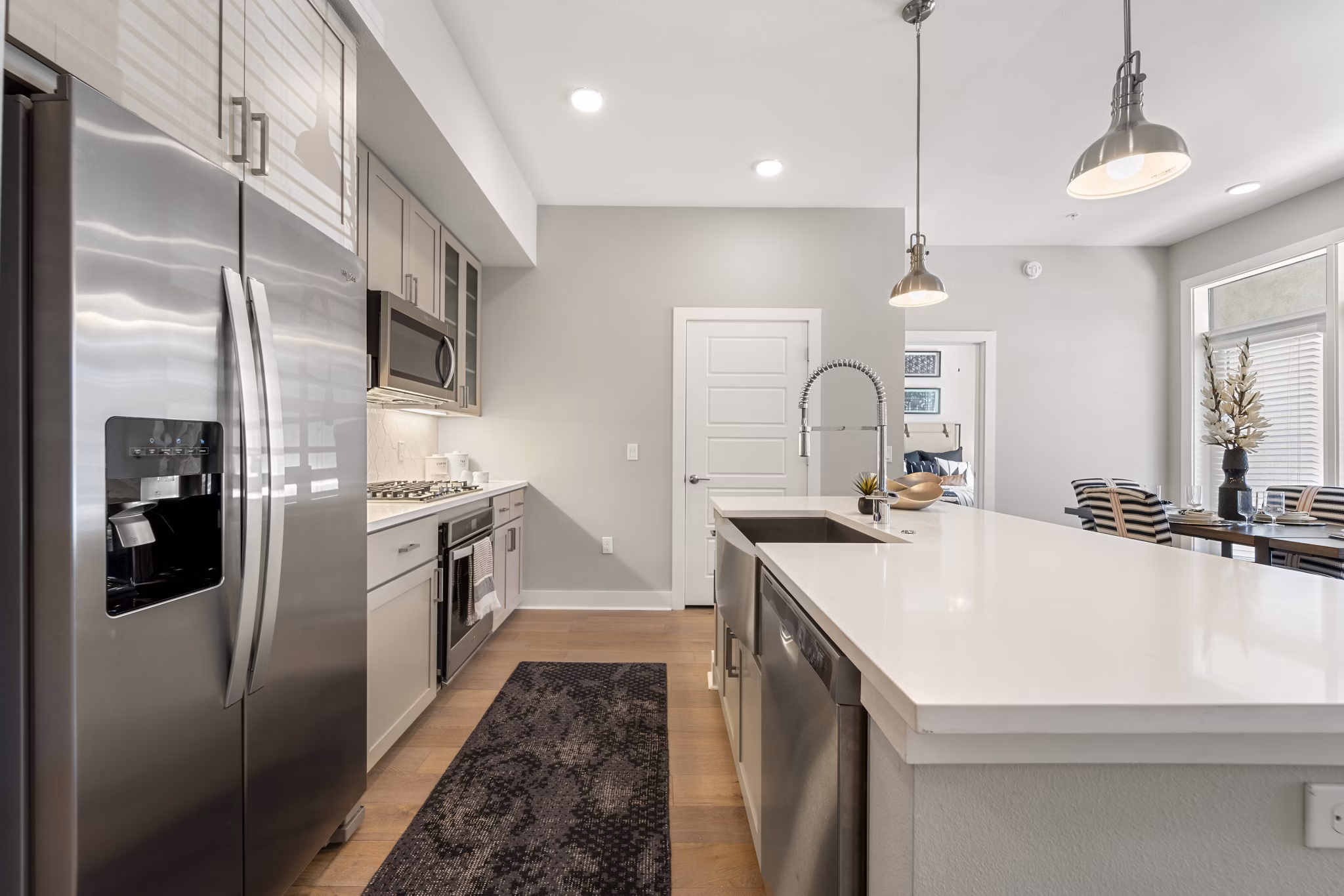 Maxwell on 66th Apartments: Modern kitchen with stainless steel appliances and sleek countertops, ideal for luxury living