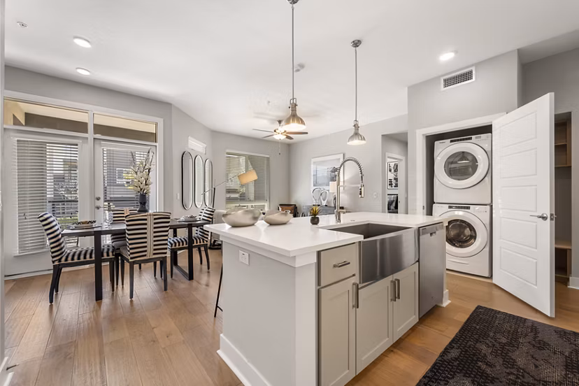 Modern kitchen with sleek countertops and stainless steel appliances at Maxwell on 66th Apartments in Greystar's luxury housing collection