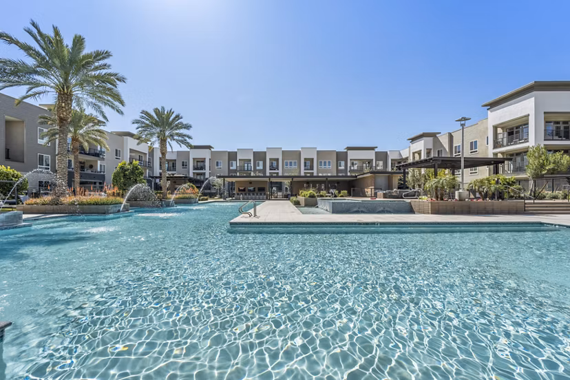 Infinity pool with loungers at Maxwell on 66th Apartments