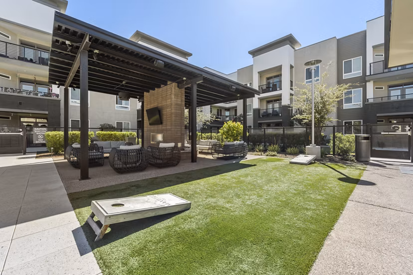 Spacious dog park with agility equipment at Maxwell on 66th Apartments providing a fun and safe space for pets to play and socialize