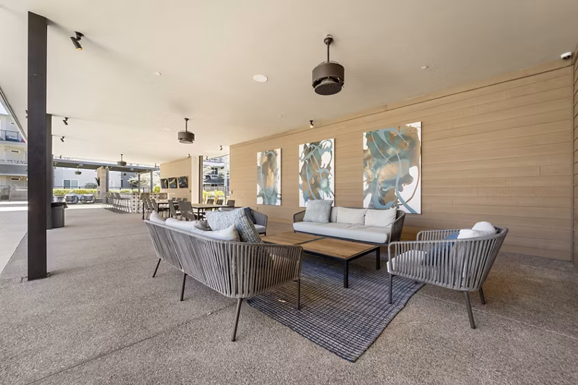 Grill area with modern barbecue stations at Maxwell on 66th Apartments, a luxury Greystar community