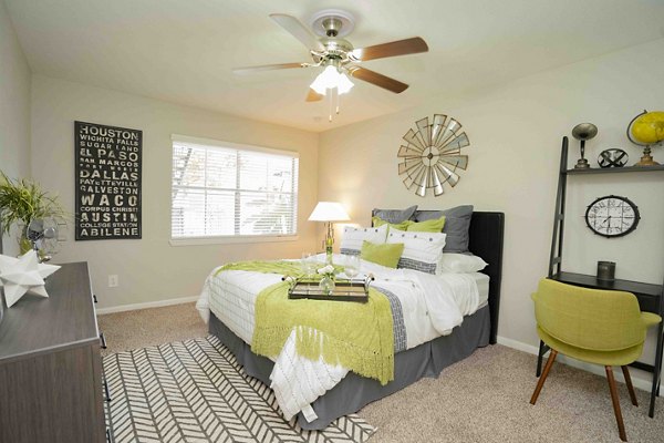 Master bedroom featuring modern decor and ample natural light in 3 Corners East Apartments