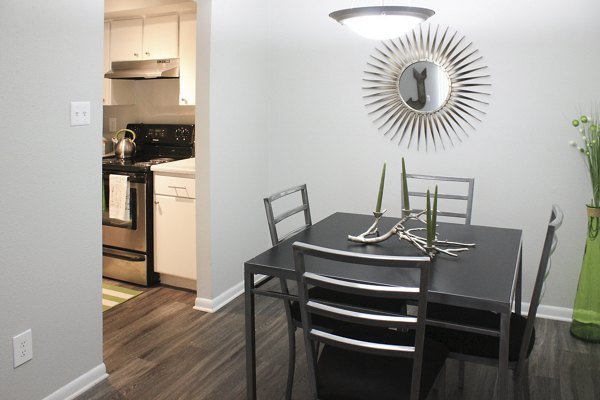 Dining area featuring elegant table settings in 3 Corners East Apartments, showcasing a modern living experience