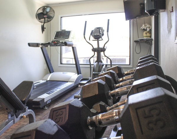 Well-equipped fitness center with modern machines at 3 Corners East Apartments