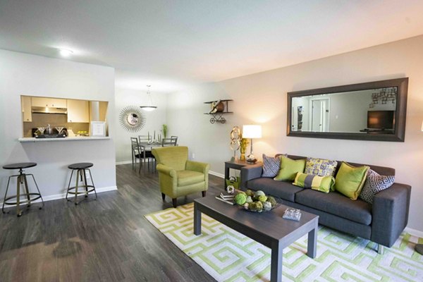 Spacious living room with modern decor at 3 Corners East Apartments