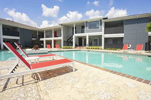 Rooftop pool with lounging areas at 3 Corners East Apartments, ideal for relaxation and leisure activities