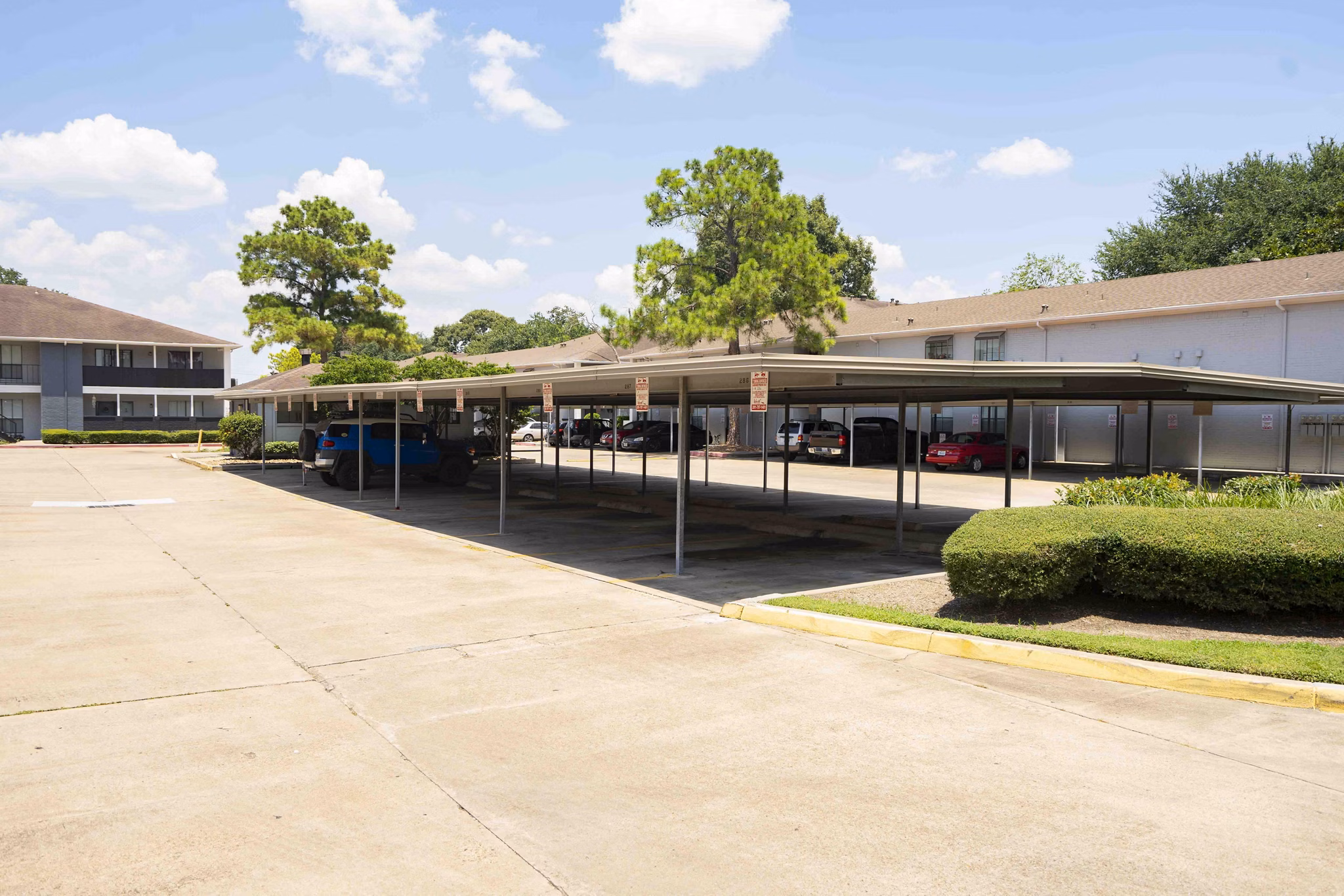 Covered parking facility at 3 Corners North Apartments offering secure vehicle storage