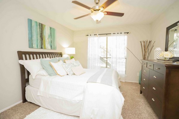 Modern bedroom with natural light at 3 Corners North Apartments