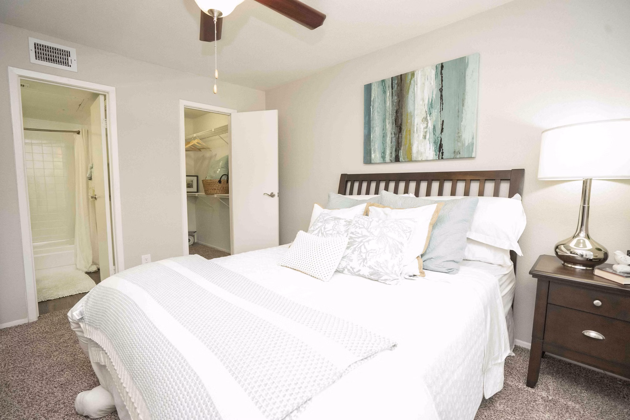 Cozy bedroom featuring modern decor and plush bedding at 3 Corners North Apartments