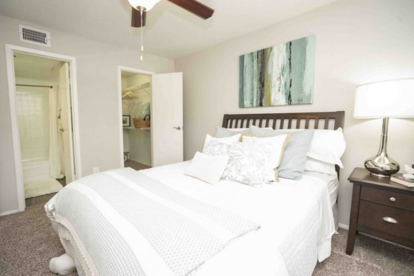 Cozy bedroom featuring modern decor and plush bedding at 3 Corners North Apartments