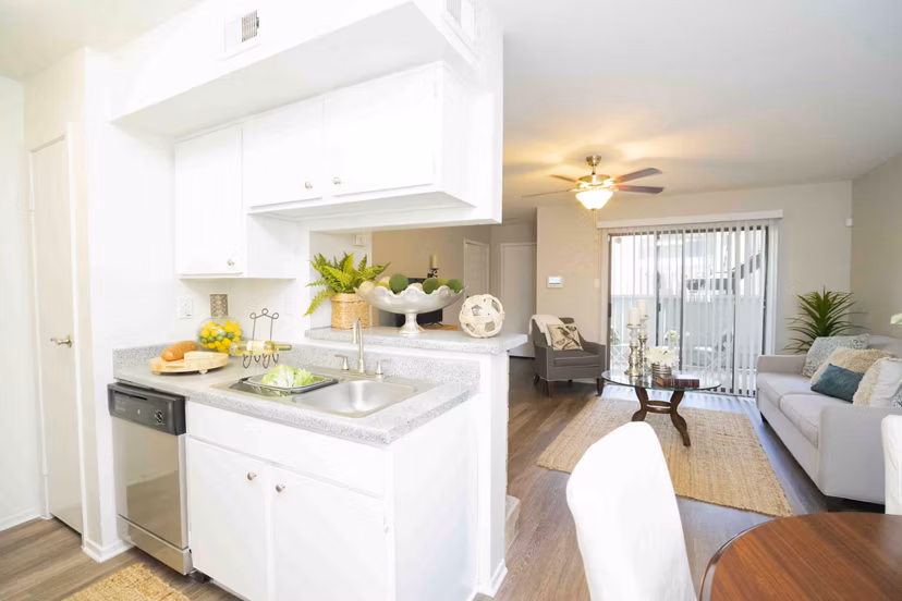 Modern kitchen with sleek countertops and stainless steel appliances in 3 Corners North Apartments
