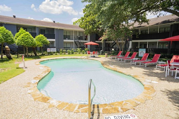 Sunlit outdoor pool at 3 Corners North Apartments, ideal for relaxation and socializing in a serene setting