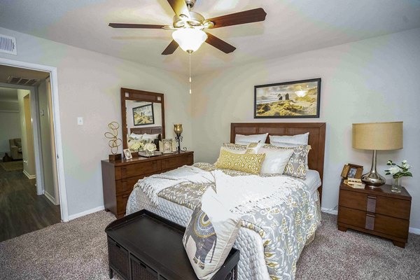 Cozy bedroom with stylish furnishings at 3 Corners West Apartments
