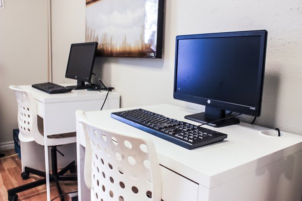 Modern business center featuring workstations and Wi-Fi at 3 Corners West Apartments