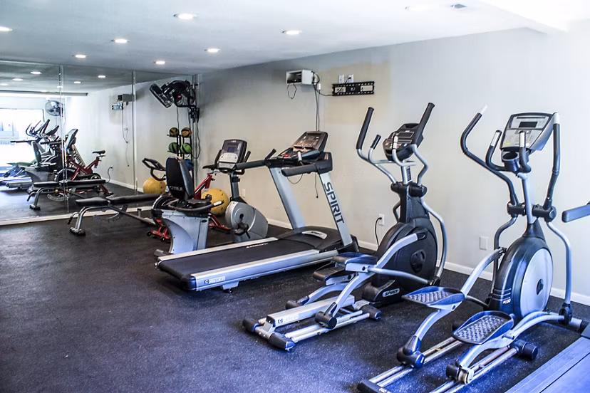 State-of-the-art fitness center at 3 Corners West Apartments, featuring modern equipment and spacious workout areas