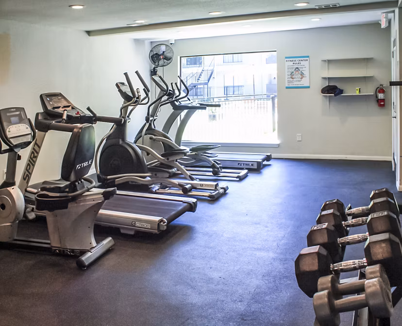 Fitness center with modern equipment at 3 Corners West Apartments