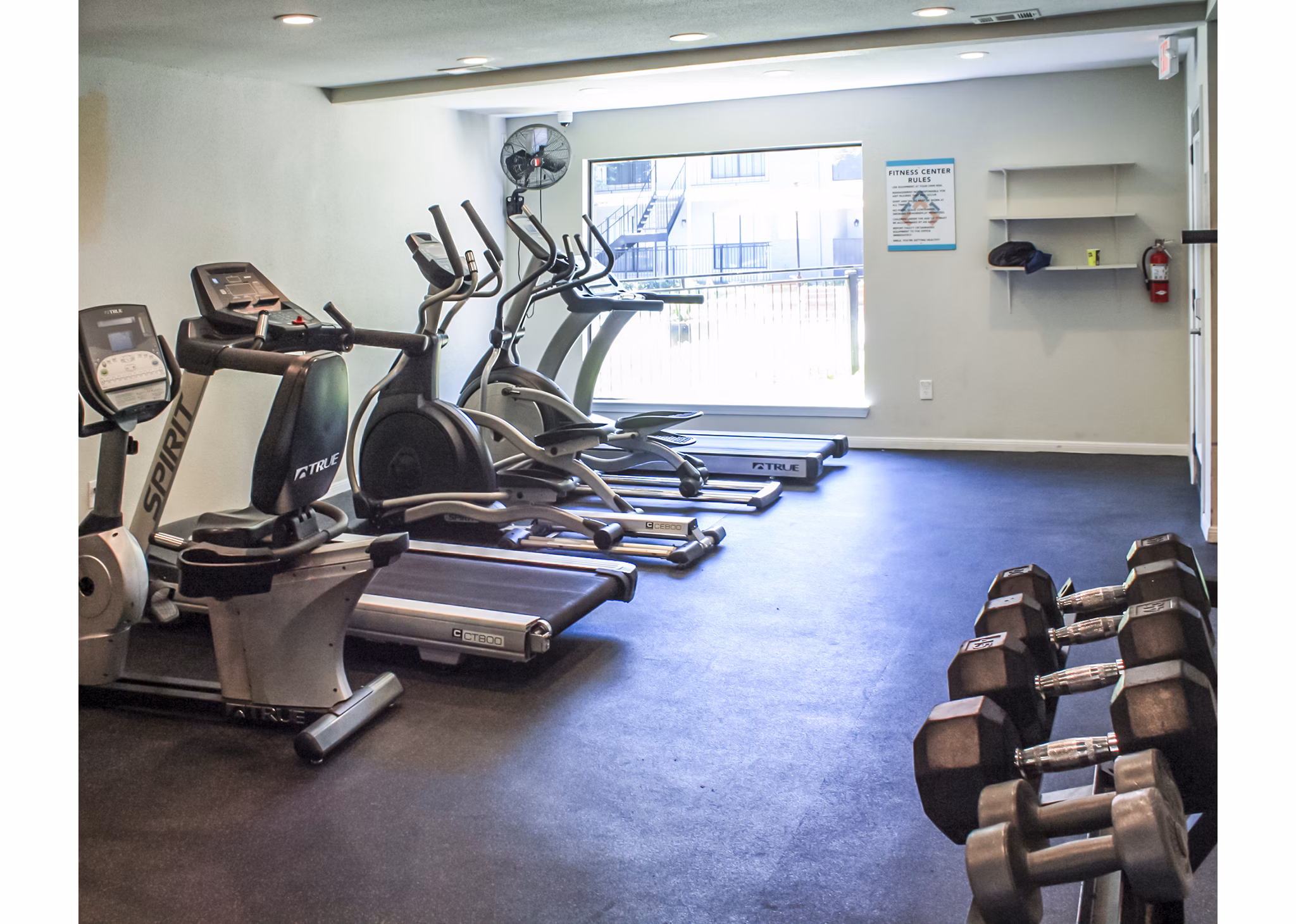 Fitness center with modern equipment at 3 Corners West Apartments