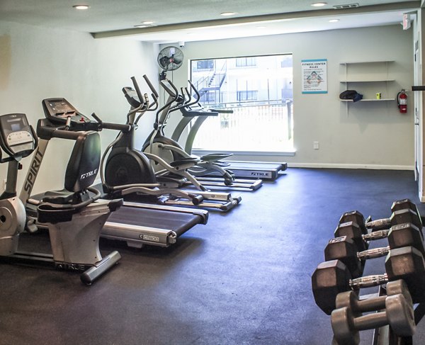 Fitness center with modern equipment at 3 Corners West Apartments