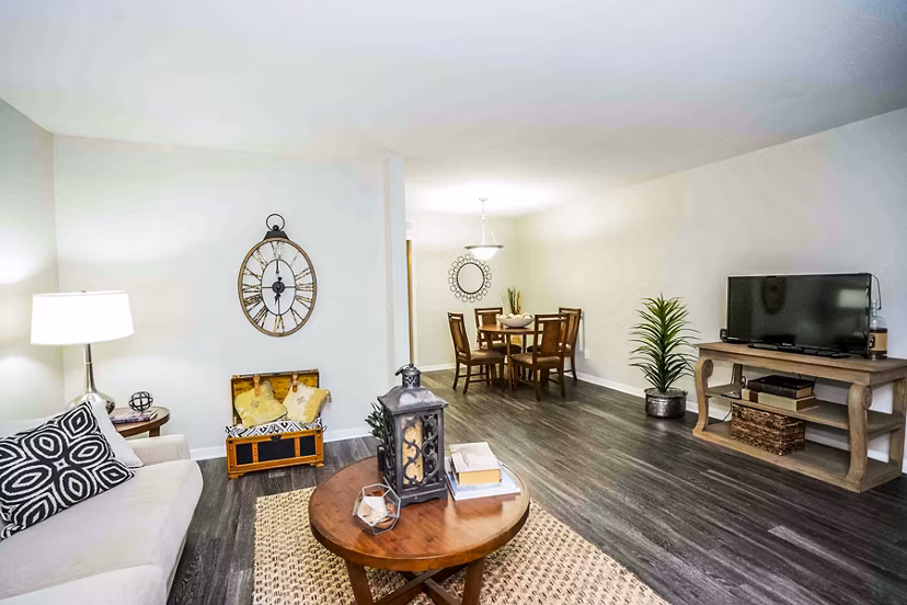 Spacious living room with contemporary furnishings in 3 Corners West Apartments