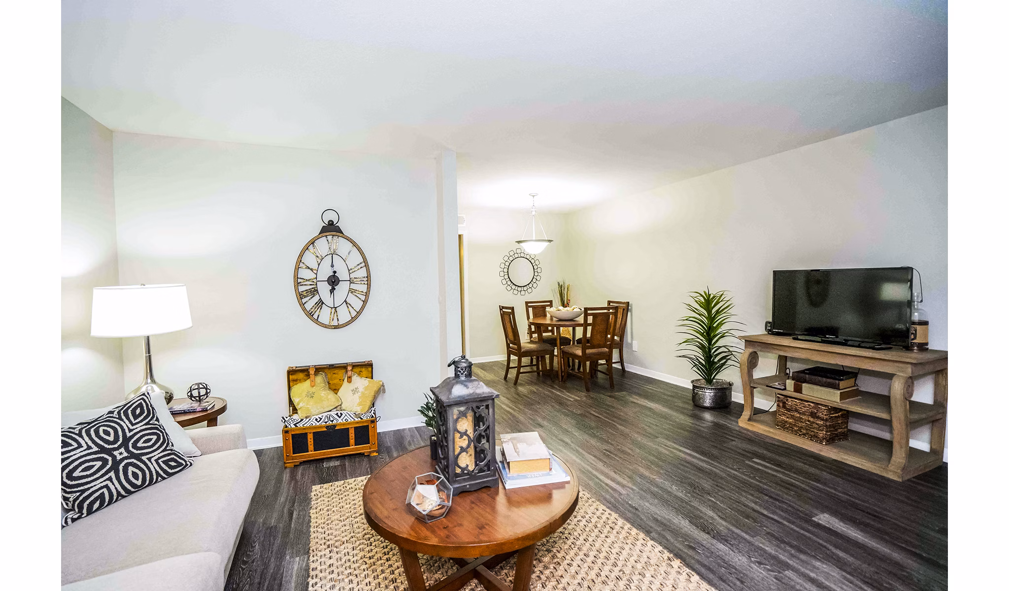 Spacious living room with contemporary furnishings in 3 Corners West Apartments